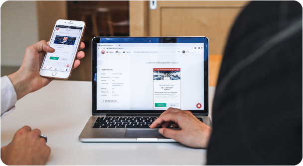 Responsive manufacturing website shown across laptop and mobile screens