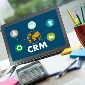 Web Design Image Team discussing how to pick a CRM in office meeting